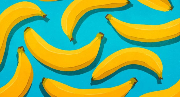 An illustrated images of bananas on a light blue background.
