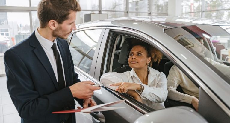 A woman buying a car.